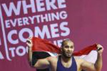 Sabah Mohammed Abdulmalek of Iraq celebrates after winning gold medal against Hani Marafi of Jordan in the men's 120kg Greco-Roman wrestling final at the Arab Games in Doha December 19, 2011. REUTERS