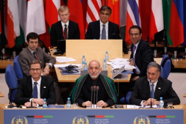 German Foreign Minister Guido Westerwelle, Afghanistan's President Hamid Karzai and Iran's Foreign Minister Ali Akbar Salehi (L-R) listen during the conference on Afghanistan at the former German parliament in Bonn, December 5, 2011.