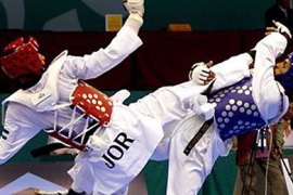 Anas al-Adarbi (L) of Jordan and Saifeddine Trabelsi of Tunisia challenge each other during their men's 74kg Taekwondo competition at the 2011 Arab Games in the Qatari capital Doha on December 14, 201... Read more