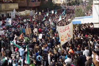 A handout picture released by the Local Coordination Committees of Syria (LCC Syria) shows anti government protesters gathered in the Bab al-Amr neighborhood in the restive Syrian city of Homs, on January 21, 2012.