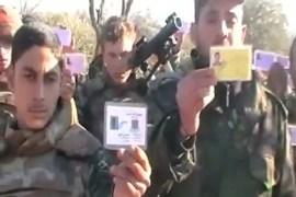 An image grab taken from a video uploaded on YouTube shows Syrian army defectors displaying their identity card as some 15 soldiers reportedly pledge allegiance to the opposition in the northern city of Idlib on January 2, 2012. Syria on January 5 released 552 people who were detained over their involvement in political unrest and who have "no blood on their hands," the official SANA news agency reported.