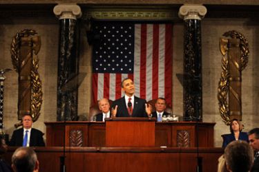 epa03076924 US Vice President Joe Biden (C-L) and Speaker of the House John Boehner (C-R) listen as US President Barack Obama (C) delivers his State of the Union address before a joint session of Congress on Capitol Hill in