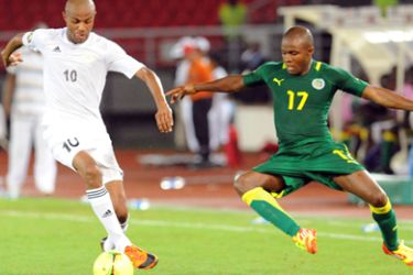 Senegal's National football team player Omar Daf (R) vies for the ball with Libya's Ahmed Osmane (L), on January 29, 2012, in Bata, during their 2012 Africa Cup of Nations football match.