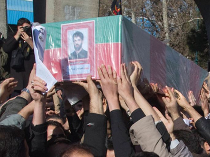 Iranian worshippers carry the coffin of Iranian nuclear scientist Mostafa Ahmadi-Roshan, who was killed in a bomb blast in Tehran on January 11, during his funeral after Friday prayers in Tehran January 13, 2012.