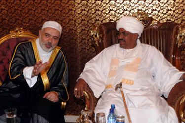 handout from the Hamas Press Office shows Sudanese President Omar al-Bashir (R) meeting with Palestinian prime minister Ismail Haniya before Friday prayers at the Nur mosque in Khartoum on December 30