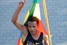 Ethiopia's Ayele Abshero celebrates after winning the men's Dubai Marathon in the Gulf emirate on January 27, 2012. AFP PHOTO/STR