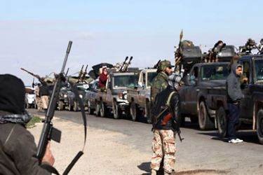 Libya's former rebels gather on January 25, 2012 at a checkpoint near a mosque, 60 kms from the town of Bani Walid, the former bastion of slain dictator Moamer Kadhafi.