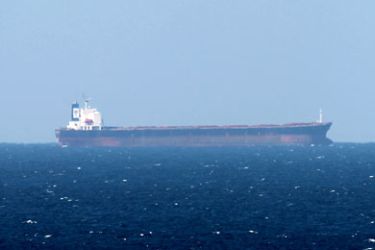 epa03060774 An Oil tanker is seen in the Strait of Hormuz from Khasab, Oman on 15 January 2012