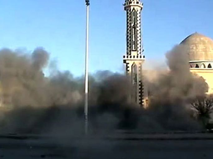 An image grab taken from a video uploaded on YouTube on February 8, 2012 shows smoke billowing following a blast in front of a mosque in the Baba Amro neighbourhood in the flashpoint city of Homs,