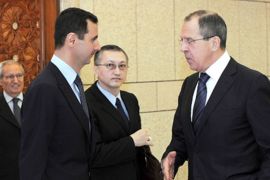 Syria's President Bashar al-Assad (L) talks to Russia's Foreign Minister Sergei Lavrov (R) in Damascus February 7, 2012, in this handout photograph released by Syria's national news agency SANA. Lavrov began talks with Assad on Tuesday by saying Moscow wants Arab peoples to live in peace and the Syrian leader is aware of his responsibility, Russian news agency RIA reported.