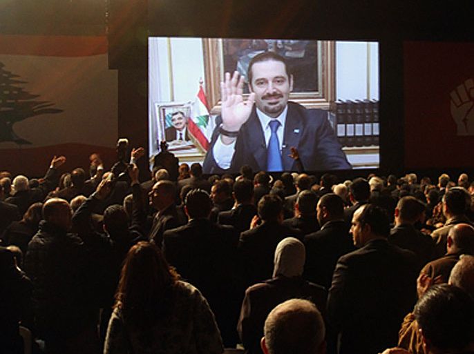 Former Lebanese premier Saad Hariri addresses via videolink a commemoration ceremony organised by his pro-Western opposition bloc for his slain father in Beirut on February 14, 2012, the seventh anniversary of ex-premier Rafiq Hariri's assassination in a massive car bomb attack that killed him along with 21 others while driving through the Lebanese capital.