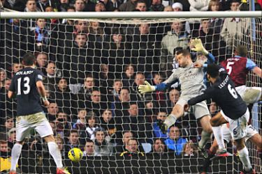 Manchester City's English defender Joleon Lescott scores the opening goal during their English Premier League football match against Aston Villa at Villa Park in Birmingham