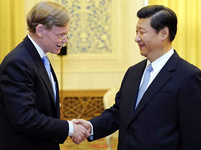 r_World Bank President Robert Zoellick (L) shakes hands with China's Vice President Xi Jinping during a meeting at the Great Hall of the People in Beijing, September 5, 2011