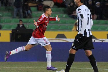 Milan's Stephan El Shaarawy (L) celebrates scoring during the Serie A football match between Udinese and Milan at the Friuli Stadium on February 11, 2012