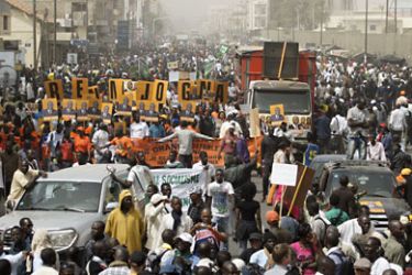 Protestors with Senegal's opposition M23 movement take to the streets on February 7, 2012 in Dakar.