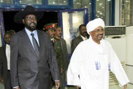 Sudan's First Vice President and south Sudan leader Salva Kiir (L) welcomes home Sudan's President Omar al-Bashir following his visit to Ndjamena, Chad, to attend the 12th Community of Sahel-Saharan (CEN-SAD) states summit on July 23, 2010 in Khartoum.