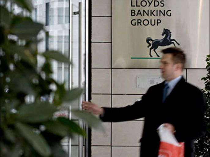 afp : A man enters the London headquarters of Lloyds Banking Group on March 6, 2009. Britain is poised to increase its stake in Lloyds Banking Group as part of a deal that would also see the group agree to the government insuring its risky assets, the BBC reported Thursday. It said the two sides were on the verge of a deal that would see the government increase its stake in LBG -- created earlier this year from the merger of rivals HBOS and Lloyds TSB -- from 43 percent to up to 60 percent. This would be achieved by converting the expensive shares already held by the taxpayer to ordinary shares that carry voting rights. AFP PHOTO/Ben Stansall