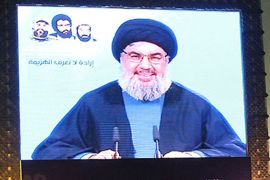 Lebanese Hezbollah leader Hassan Nasrallah speaks via video link to a crowd in Beirut's southern suburbs, on February 16, 2012. Nasrallah denied that his Shiite movement had any role in the recent Israeli diplomat attacks in Thailand, India and Georgia. AFP PHOTO/ANWAR AMRO