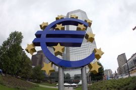 A giant symbol of the European Union's currency the Euro stands outside the headquarters of the European Central Bank (ECB) in the central German city of Frankfurt am Main on June 2, 2010الم