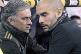 epa03066085 Real Madrid's Portuguese head coach Jose Mourinho (L) greets FC Barcelona's head coach Josep Guardiola (R) moments before their Spanish King's Cup quarterfinals first leg soccer match at Santiago Bernabeu stadium in Madrid, central Spain, on 18 January 2012.