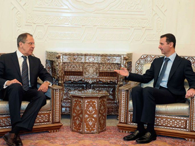 Syrian President Bashar al-Assad (R) speaks with with Russian Foreign Minister Sergey Lavrov during their meeting in Damascus February 7, 2012. Lavrov began talks with Assad on Tuesday by saying Moscow wants Arab peoples to live in peace and the Syrian leader is aware of his responsibility, Russian news agency RIA reported.