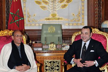 Tunisia's new President Moncef Marzouki (L) sits along with Morocco's King Mohammed VI (R) during a meeting in Rabat on February 8, 2012. Tunisia's new President Moncef
