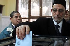 Muslim Brotherhood leader Mohammed Badee casts his ballot at a polling station in Beni Sueif, 200km south of Cairo, on February 14, 2012 during the final round of voting for the upper chamber of the Parliament or Shura.
