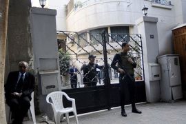 Egyptian soldiers stand guard in front of the US National Democratic Institute, an NGO (non-governmental) rights group in downtown Cairo on December 29, 2011.