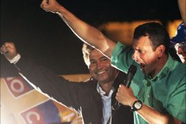 Venezuelan opposition leader Henrique Capriles Radonski celebrates after winning the primary elections in Caracas on February 12, 2012
