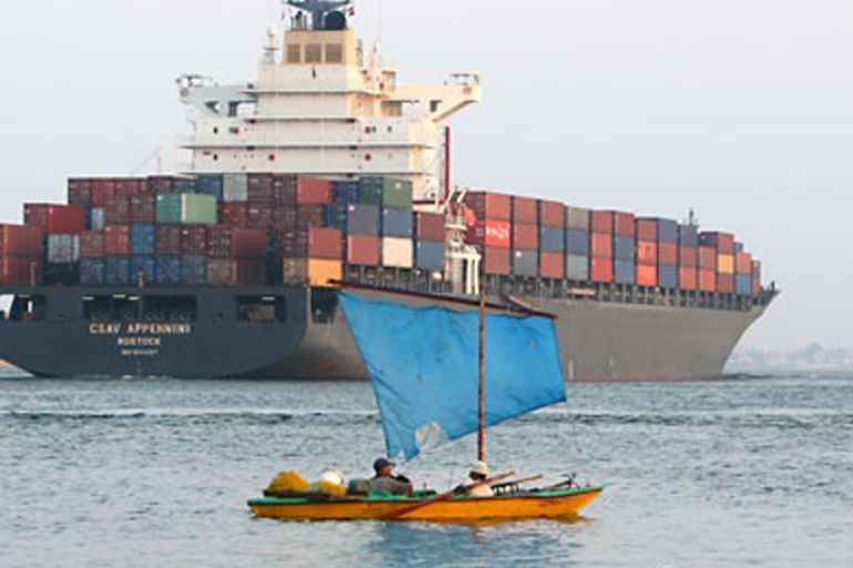 epa02251924 A container vessel passes the Suez Canal in Ismailia, Egypt, on 17 July 2010. The 192 kilometer long canal linking the Mediterranean Sea and the Red sea is a major source of foreign currency revenue for Egypt, along with tourism.