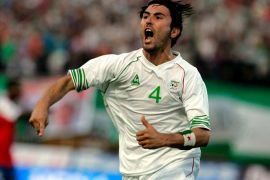 epa01390450 Algeria's Antar Yahia celebrates after scoring against Gambia, during their African Zone World Cup 2010 qualifying soccer match in Blida stadium, Algeria, 20 June 2008. EPA/MOHAMED MESSARA