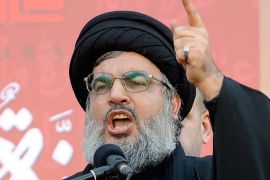 epa03025663 Hezbollah leader Hassan Nasrallah gestures as he speaks during his first public appearance since 2008, in Ashura day in southern Beirut, Lebanon, 06 December 2011. Shiite Muslims are observing the holy month of Muharram the climax of which is the Ashura festival commemorating the martyrdom