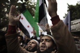 Egyptian protesters and Syrians living in Egypt chant slogans calling for the expulsion of the Syrian ambassador during a demonstration outside the Syrian embassy in Cairo February 17, 2012