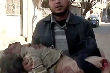 An image grab taken from a video uploaded on YouTube on February 5, 2012 shows a Syrian man holding a girl who activists said was killed in the Baba Amr neighbourhood