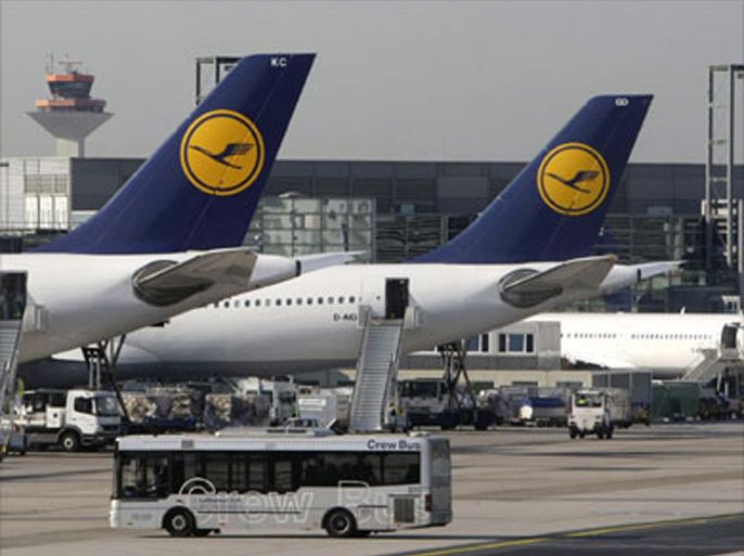 Airplanes of German airline Lufthansa stand in their parking positions as a crew bus drives by at Frankfurt airport August 7, 2008. Lufthansa faced further strikes on Thursday after pilots at its CityLine regional carrier, which operates some 400 of the group's 2,000 daily flights, walked out for 36 hours at 2200 GMT on Wednesday in an ongoing pay dispute.