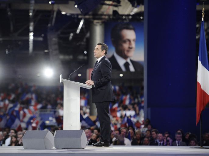 France's incumbent president and Union for a Popular Movement (UMP) candidate for 2012 presidential election Nicolas Sarkozy arrives delivers a speech during a campaign meeting on March 11, 2012 in Villepinte, out of Paris. French President Nicolas Sarkozy holds a huge rally today in hopes of energizing his campaign as polls show him lagging behind Socialist rival. French President Nicolas Sarkozy holds a huge rally today in hopes of energizing his campaign as polls show him lagging behind Socialist rival. AFP PHOTO / LIONEL BONAVENTURE