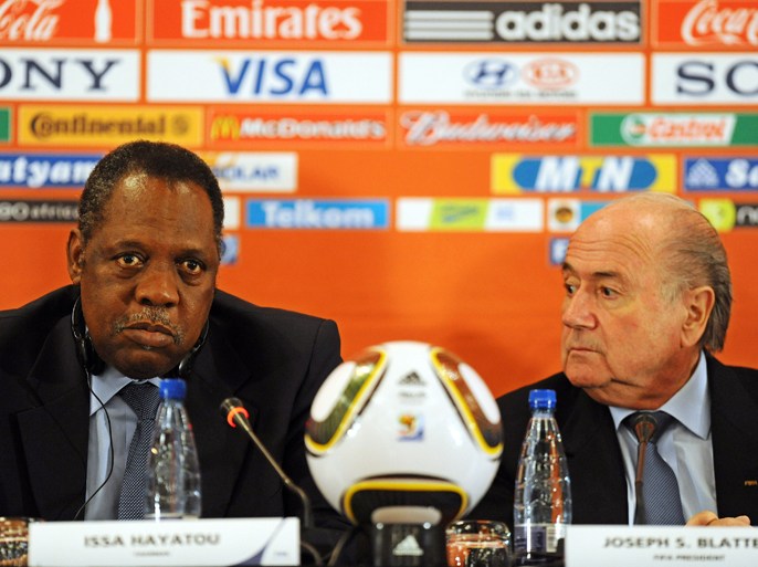 epa02241365 FIFA President Joseph S. Blatter (R) and Issa Hayatou (L), Chairman of the Organising Committee of the FIFA 2010 World Cup and FIFA Vice-President, attend the FIFA press conference in Joahnnesburg, South Africa, 08 July 2010.