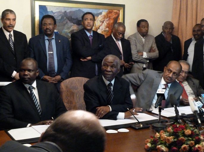 African Union, Thabo Mbeki (centre) and Sudan’s head negotiator Idriss Abdu Qadir , attend African Union-led talks between Sudan and South Sudan in Addis Ababa on March 13, 2012