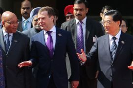 INDIA : Russia's President Dmitry Medvedev (2nd L) speaks with South Africa President Jacab Zuma (L) and Chinese President Hu Jintao (R) as they arrive for a photo-op prior to BRICS summit in New Delhi on March 28, 2012. The leaders of BRICS countries gather for their fourth summit, with the emerging market bloc struggling to convert its growing economic strength into collective diplomatic clout. Brazil, Russia, India, China and South Africa