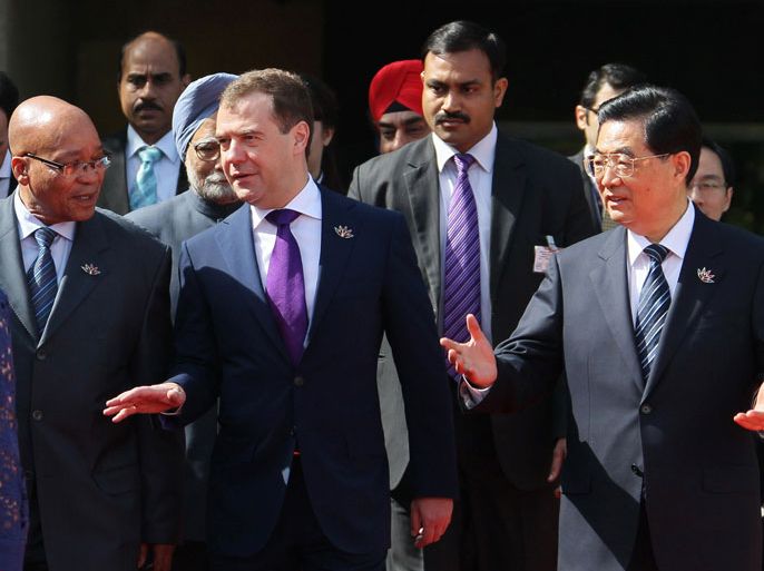 INDIA : Russia's President Dmitry Medvedev (2nd L) speaks with South Africa President Jacab Zuma (L) and Chinese President Hu Jintao (R) as they arrive for a photo-op prior to BRICS summit in New Delhi on March 28, 2012. The leaders of BRICS countries gather for their fourth summit, with the emerging market bloc struggling to convert its growing economic strength into collective diplomatic clout. Brazil, Russia, India, China and South Africa