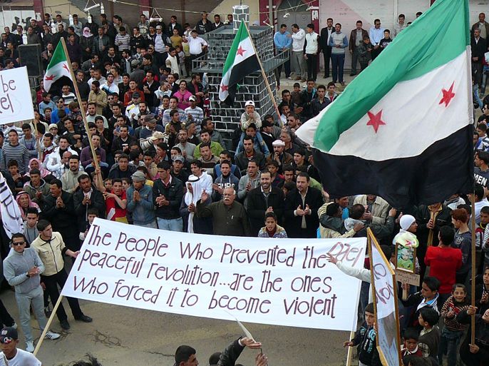 A handout picture released by the General Committee of the Syrian Revolution on March 30, 2012 shows Syrian anti-regime protesters waving pre-Baath Syrian flags during a demonstration in Dael in the southern Syrian province of Daraa. International envoy Kofi Annan urged Syria's President Bashar al-Assad to immediately implement a ceasefire, as fighting raged even after the embattled leader said he had accepted the peace plan. AFP