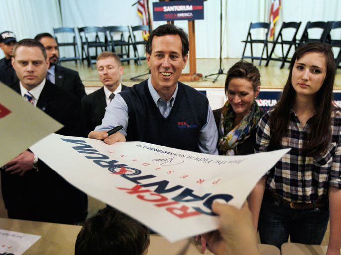Republican presidential candidate and former U.S. Sen. Rick Santorum (R-PA) greets people during a campaign rally at an American Legion on March 5, 2012 in Westerville, Ohio