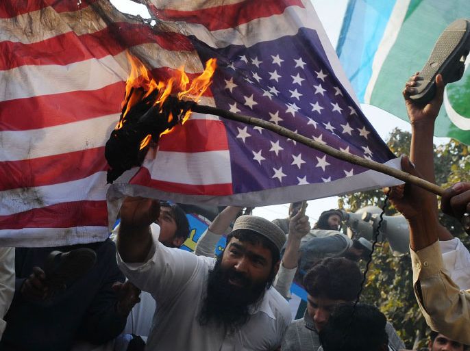 Activists of Jamaat-ud-Dawa burn a US flag at a protest rally in Lahore on March 9, 2012, against alleged US involvement in Pakistan's south-western Baluchistan province. Pakistan's Prime Minister Yousuf Raza Gilani has condemned a resolution introduced by a US lawmaker calling for self-determination in restive Baluchistan province. Republican Representative Dana Rohrabacher said. AFP PHOTO/ TOPSHOTS/ ARIF ALI