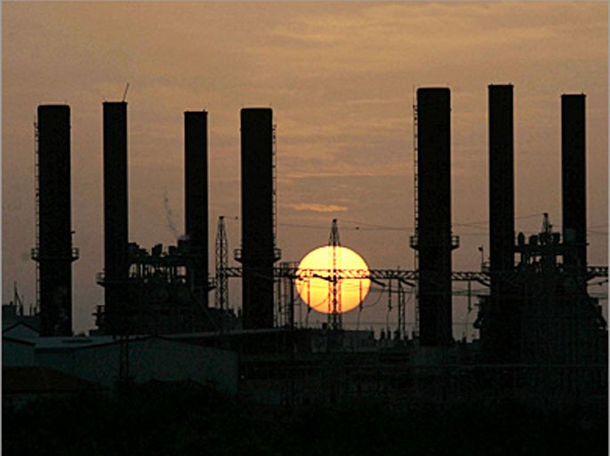 AFP/ The sun sets behind the main Palestinian electricity company, Al-Nuseirat, in the central Gaza Strip, 20 January 2008. Gaza reeled from power outages today as Israel continued to seal off the Hamas-run territory, despite