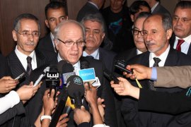 Algerian Minister for Foreign Affairs Mourad Medelci (L) and Mustafa Abdel Jalil, chairman of the ruling Libyan National Transitional Council (NTC), speaks to the press on March 5, 2012, in the Libyan capital Tripoli. AFP PHOTO/MAHMUD TURKIA