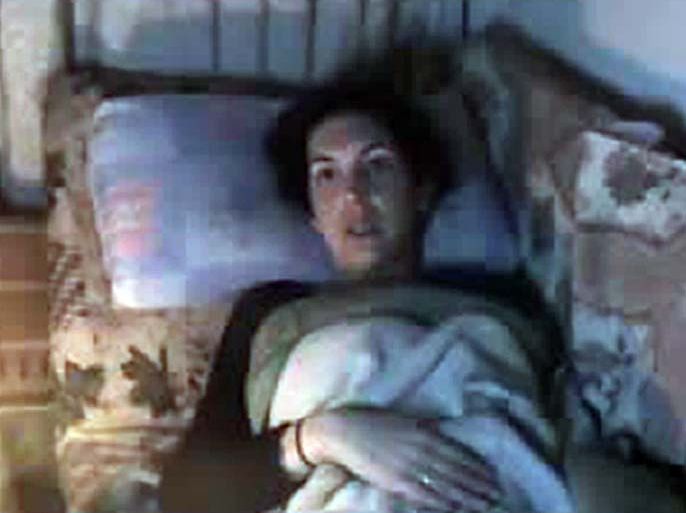 An image grab from a video uploaded on YouTube on February 23, 2012 shows French journalist Edith Bouvier, a reporter for the French daily Le Figaro who was wounded in the Syrian city of Homs the previous day, pleading for urgent medical