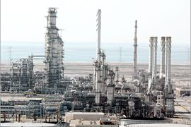 A general view shows Ras Tannura's oil production plant near Dammam in Saudi Arabia's eastern province, 27 December 2004. The world's number one producer and exporter, which already sits on 261 billion barrels of oil reserves, hopes to increase recoverable oil reserves by 200 billion barrels. Saudi Arabia's oil reserves make up a quarter of the global total. AFP PHOTO/BILAL QABALAN