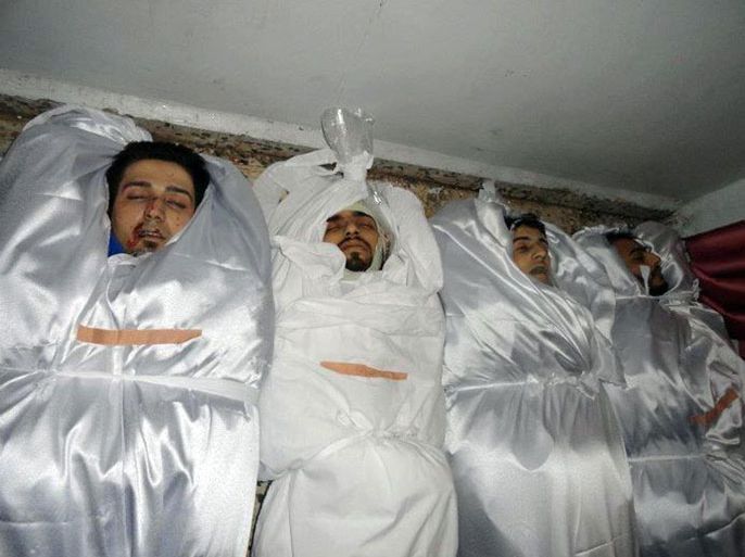 A handout picture released by Local coordination Committees in Syria (LCC Syria) on February 25, 2012 shows the body of men wrapped in shrouds ready for burial,  killed in the flashpoint city of Homs, purportedly during the bombardment of the city.
