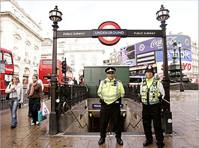 British police officers stand guard at Piccadily Circus Underground Station in central London