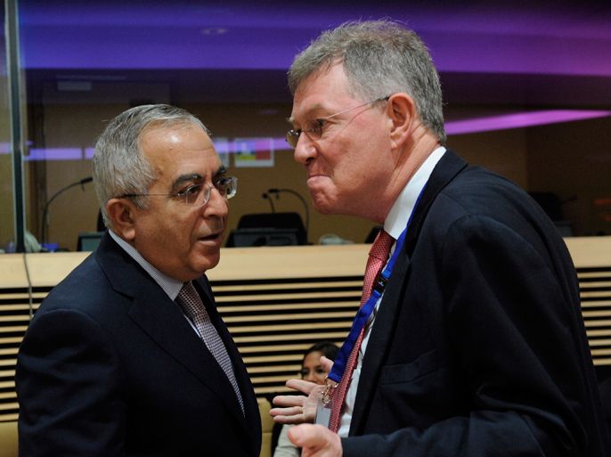 Prime Minister of the Palestinian National Authority Salam Fayyad (L) speaks with United Nations Special Coordinator for the Middle East Peace Process Robert Serry (R) before a meeting of the donor coordination group for the Palestinian people (AHLC) on March 21, 2012, at the EU Headquarters in Brussels.